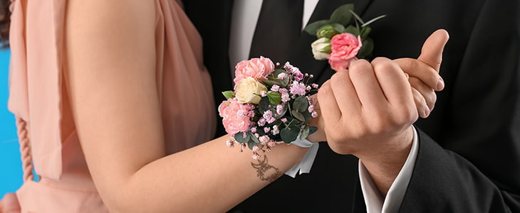 Teens in formal wear dance at a school function