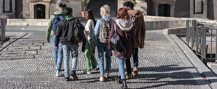 Prospective students walk on a college campus