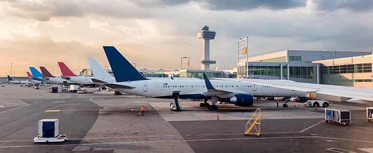 Airplanes park at gates