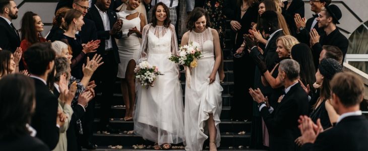 wedding guests celebrate a newlywed couple
