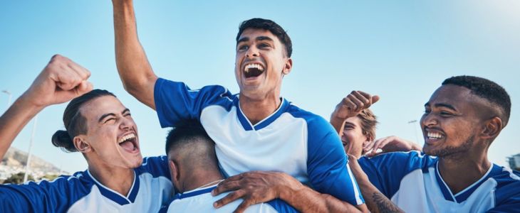 a sports team celebrates winning a game