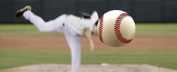 a baseball pitcher throws a baseball