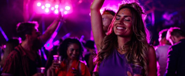 a woman dances at a concert