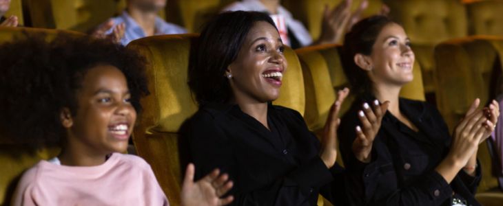 a family its in the audience at a theater
