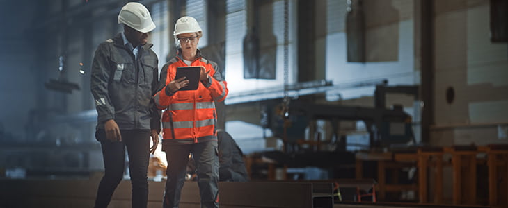 Construction employee walk through a site