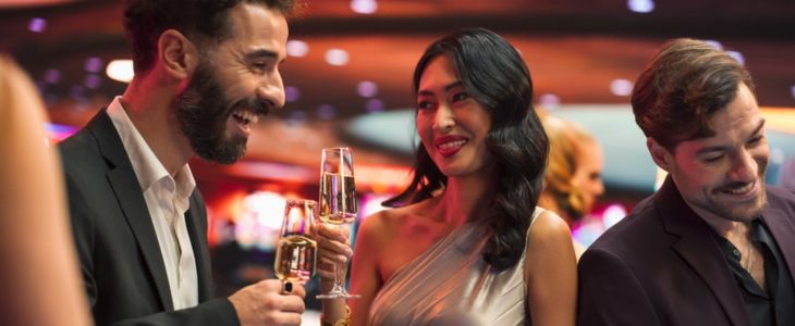 a couple share drinks at a restaurant